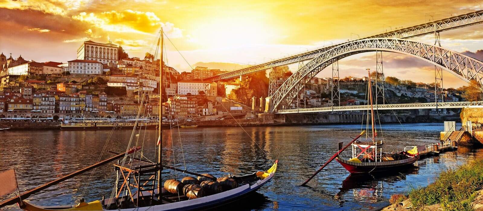 Porto, Portugal, Dom Luis bridge and boats on Douro River. © MaxFrost - stock.adobe.com